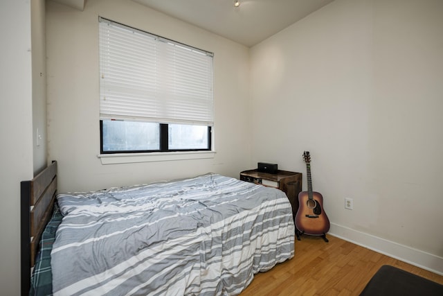 650 S Mill St Unit 219, Lexington, KY 40508 - bedroom with wood finished floors and baseboards