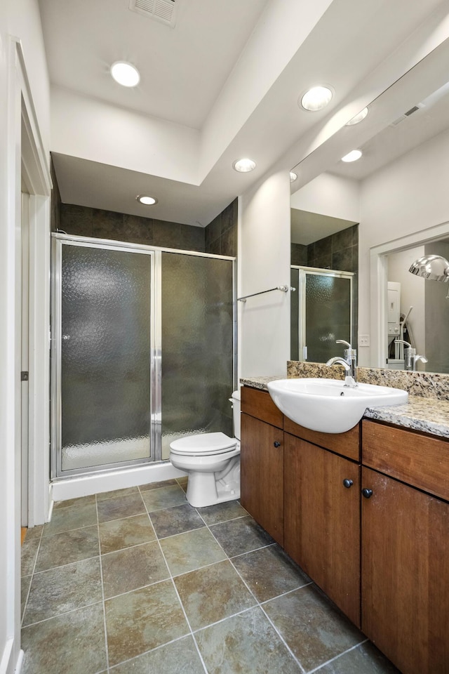 650 S Mill St Unit 219, Lexington, KY 40508 - bathroom with a shower stall, toilet, vanity, and visible vents