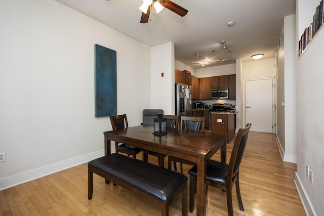 650 S Mill St Unit 219, Lexington, KY 40508 - dining room with light wood-type flooring, a ceiling fan, baseboards, and track lighting