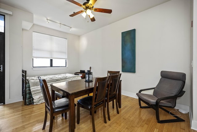 650 S Mill St Unit 219, Lexington, KY 40508 - dining room with rail lighting, baseboards, a ceiling fan, and light wood-style floors