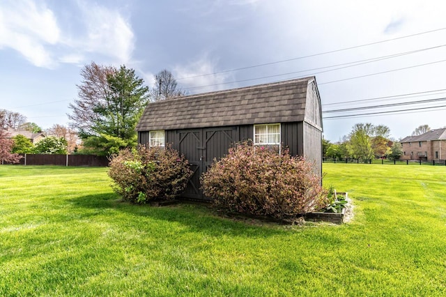 view of shed featuring fence