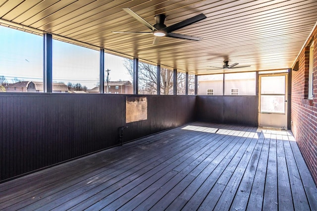 wooden deck featuring a ceiling fan
