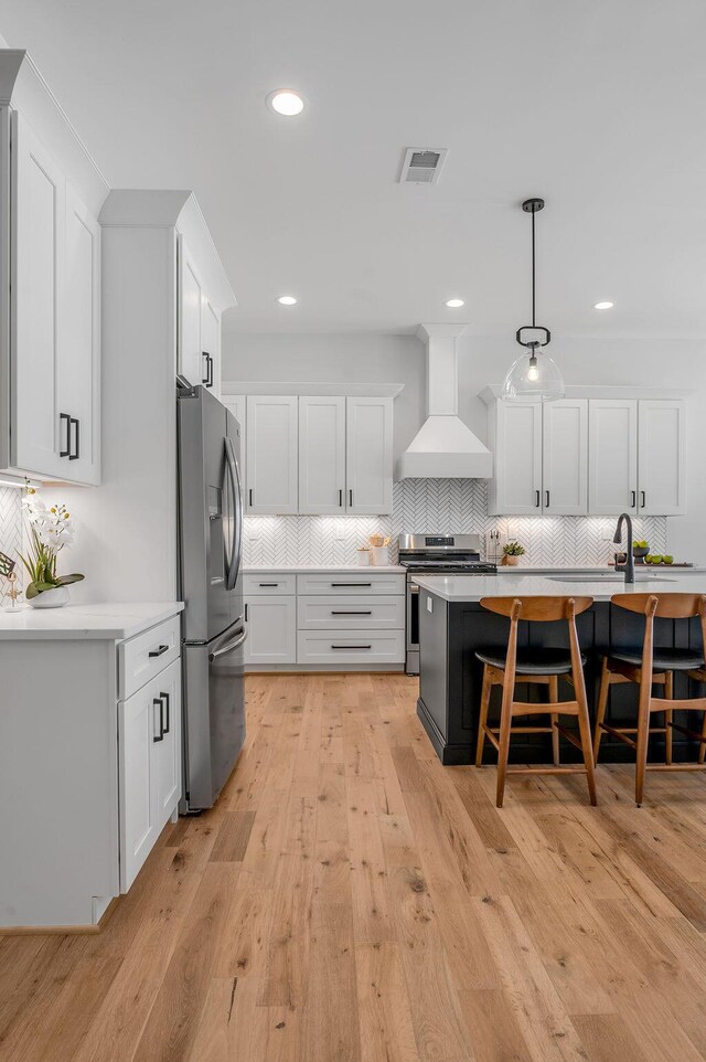 4137 Meadowlark Rd, Lexington, KY 40509 - kitchen featuring custom exhaust hood, stainless steel appliances, white cabinetry, and light countertops