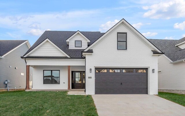4137 Meadowlark Rd, Lexington, KY 40509 - modern inspired farmhouse featuring concrete driveway, a front lawn, a porch, a garage, and brick siding
