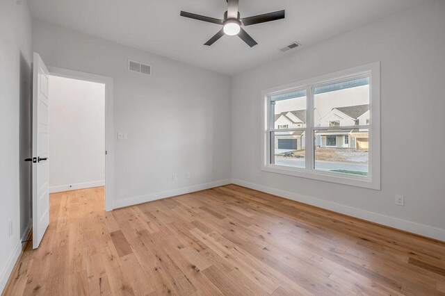4137 Meadowlark Rd, Lexington, KY 40509 - spare room with light wood-style floors, visible vents, a ceiling fan, and baseboards