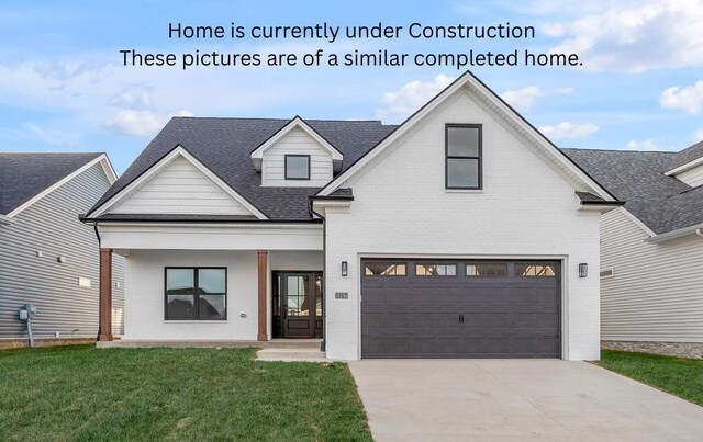4137 Meadowlark Rd, Lexington, KY 40509 - modern inspired farmhouse with driveway, covered porch, a front yard, a garage, and brick siding