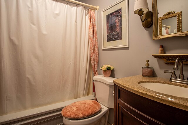 full bathroom with toilet, vanity, and shower / bathtub combination with curtain