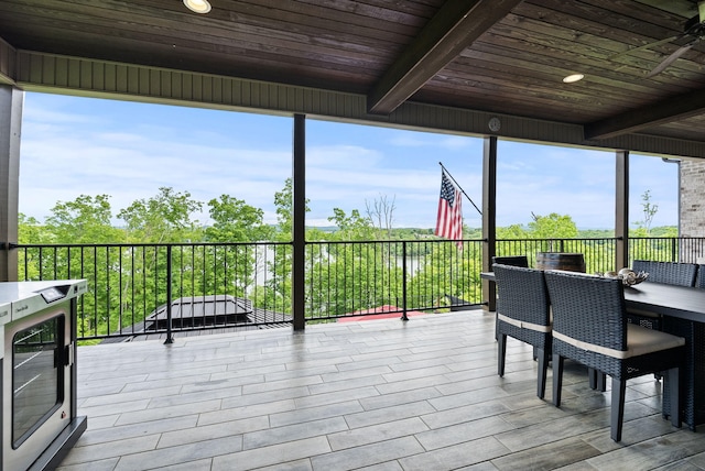 sunroom with beamed ceiling
