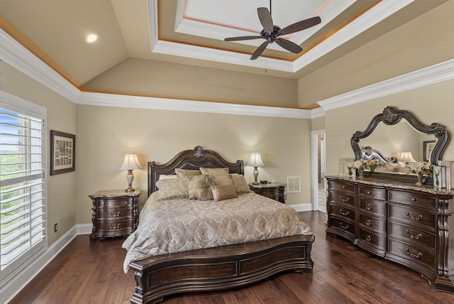 bedroom featuring baseboards, dark wood-style flooring, a tray ceiling, ornamental molding, and recessed lighting