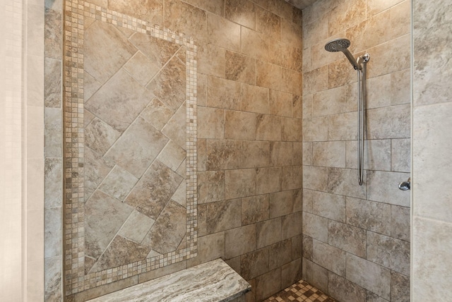 bathroom with tiled shower