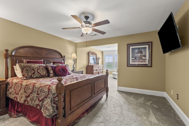 carpeted bedroom with baseboards and ceiling fan