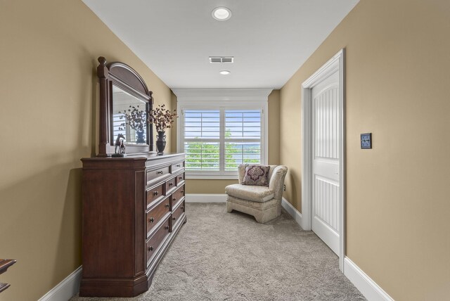 living area featuring carpet floors, baseboards, and recessed lighting
