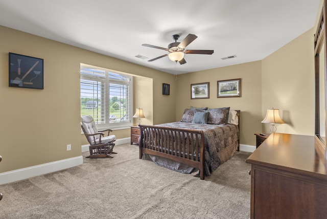 carpeted bedroom with baseboards and a ceiling fan