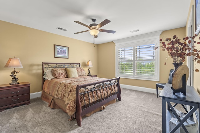 carpeted bedroom featuring baseboards and ceiling fan
