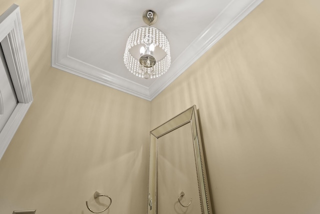 detailed view of a chandelier and crown molding