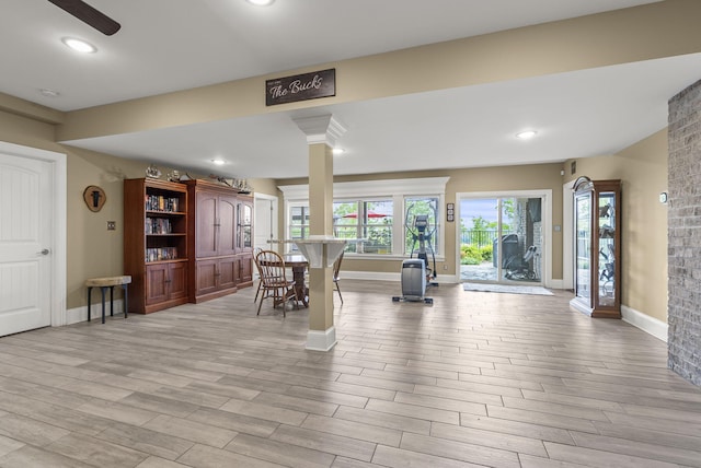 dining room with baseboards, wood finished floors, decorative columns, and recessed lighting