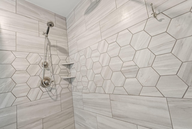 bathroom with tiled shower