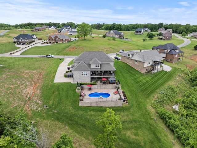 aerial view of residential area featuring a pool
