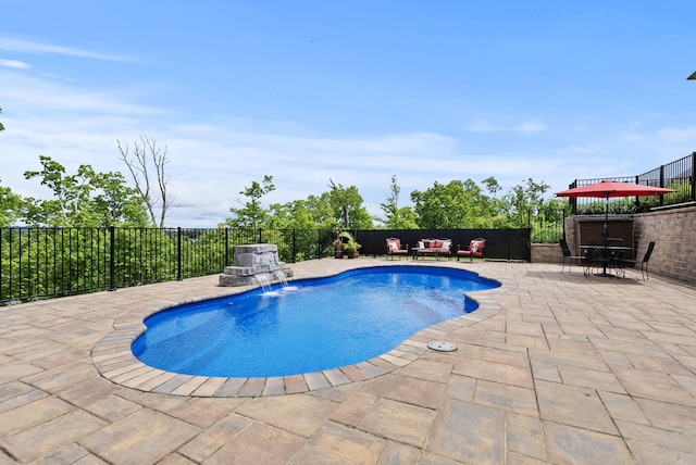 view of pool featuring a patio area, an outdoor living space, and fence