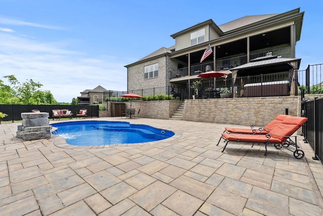 view of pool featuring a patio, a fenced backyard, and stairway