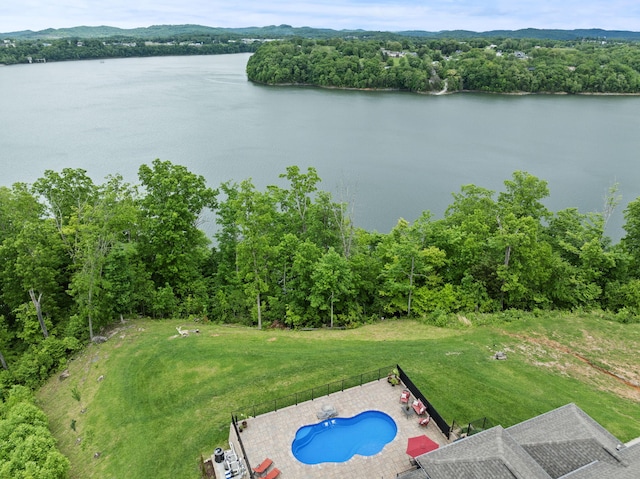 aerial view of a pool and a large body of water