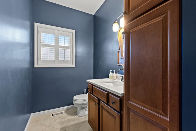 bathroom with toilet, visible vents, baseboards, tile patterned flooring, and vanity