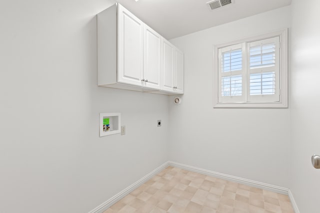 washroom with hookup for a washing machine, electric dryer hookup, cabinet space, baseboards, and visible vents