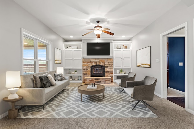 living area featuring a ceiling fan, carpet, a fireplace, baseboards, and recessed lighting