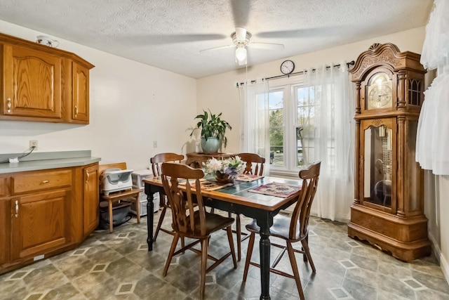 597 Snow Creek Rd, Clay City, KY 40312 - dining space featuring ceiling fan, a textured ceiling, and visible vents
