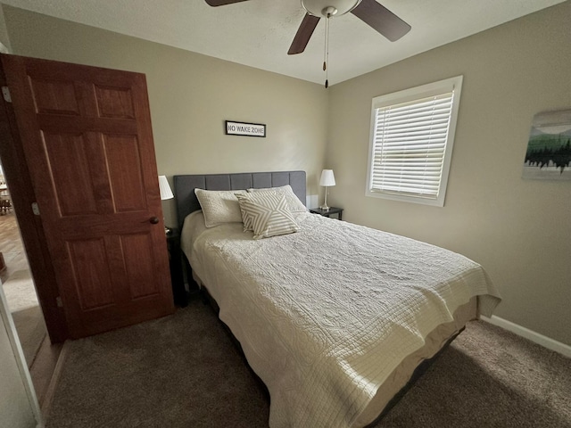 bedroom featuring baseboards, a ceiling fan, and carpet floors