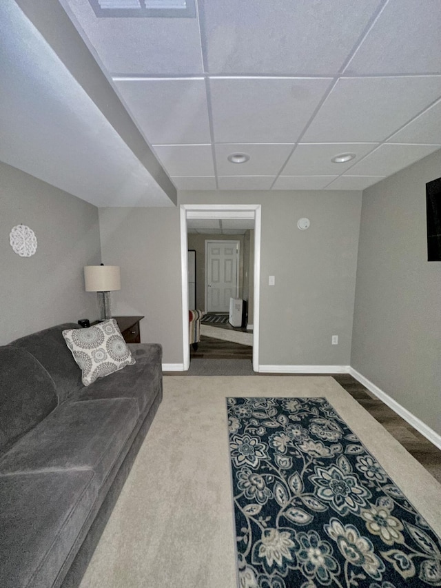 carpeted living area featuring recessed lighting and baseboards