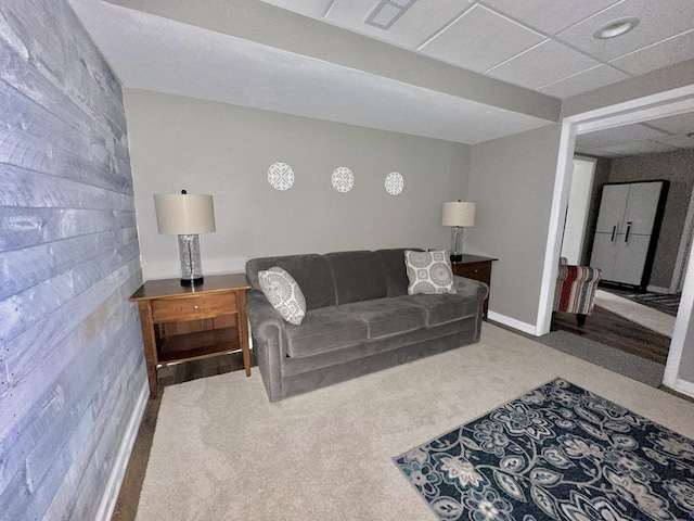 living area featuring visible vents and carpet floors