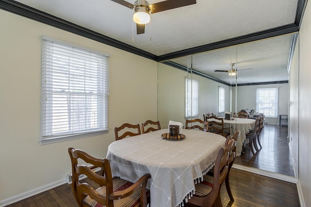 dining area with baseboards, ceiling fan, dark wood finished floors, and crown molding