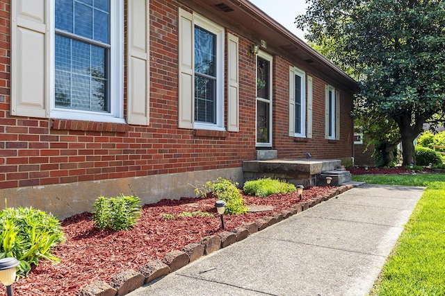 view of home's exterior with brick siding