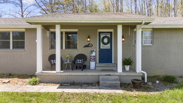 370 Poplar Ln, Morehead, KY 40351 - view of exterior entry featuring brick siding, a shingled roof, and covered porch