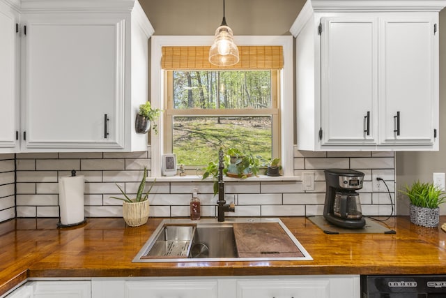 370 Poplar Ln, Morehead, KY 40351 - kitchen featuring a sink, white cabinetry, black dishwasher, and tasteful backsplash