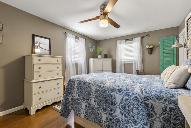 370 Poplar Ln, Morehead, KY 40351 - bedroom with baseboards, wood finished floors, ceiling fan, and multiple windows