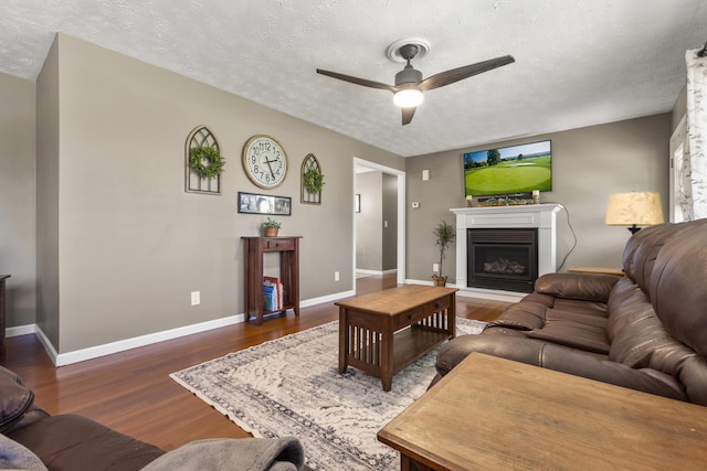 370 Poplar Ln, Morehead, KY 40351 - living room with baseboards, a ceiling fan, wood finished floors, and a textured ceiling