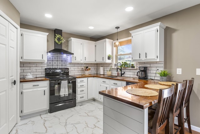 370 Poplar Ln, Morehead, KY 40351 - kitchen with recessed lighting, wall chimney range hood, a peninsula, black electric range oven, and white cabinetry