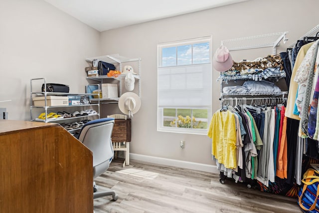 office space with baseboards and wood finished floors