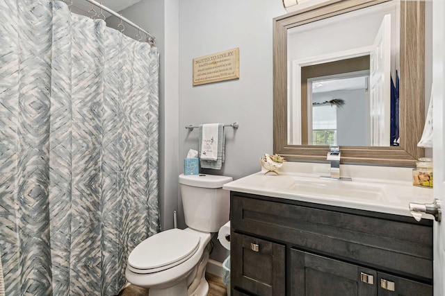 full bath with vanity, curtained shower, and toilet