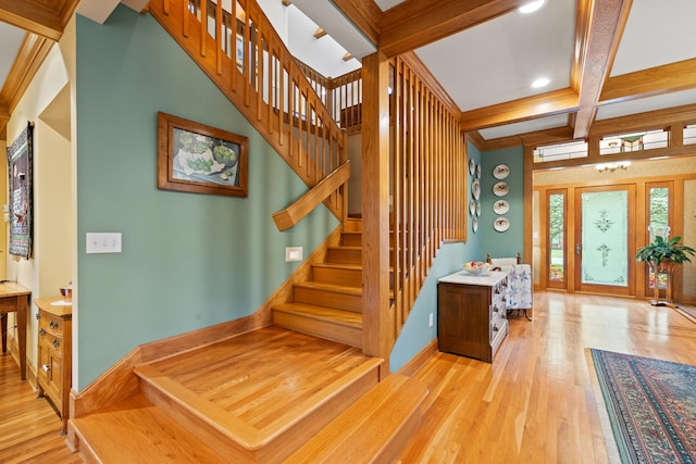 stairs with coffered ceiling, wood finished floors, beamed ceiling, and recessed lighting