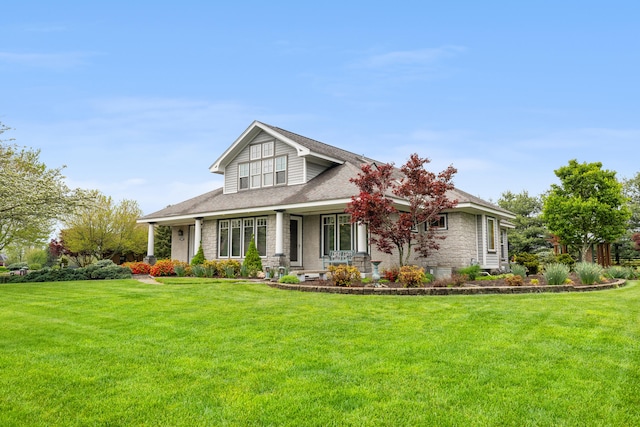 craftsman-style home featuring stone siding, roof with shingles, and a front yard