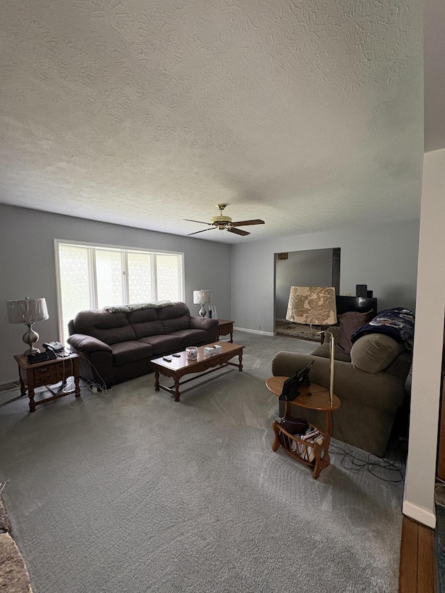 102 Locust St, Manchester, KY 40962 - living area featuring carpet floors, a textured ceiling, a ceiling fan, and baseboards