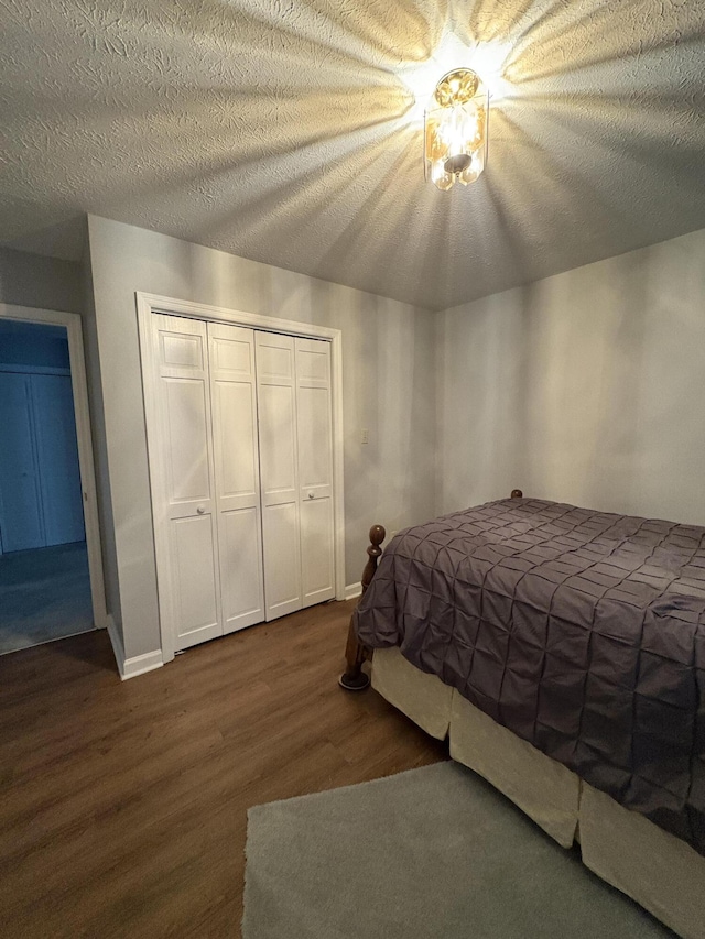 102 Locust St, Manchester, KY 40962 - bedroom featuring baseboards, wood finished floors, and a closet