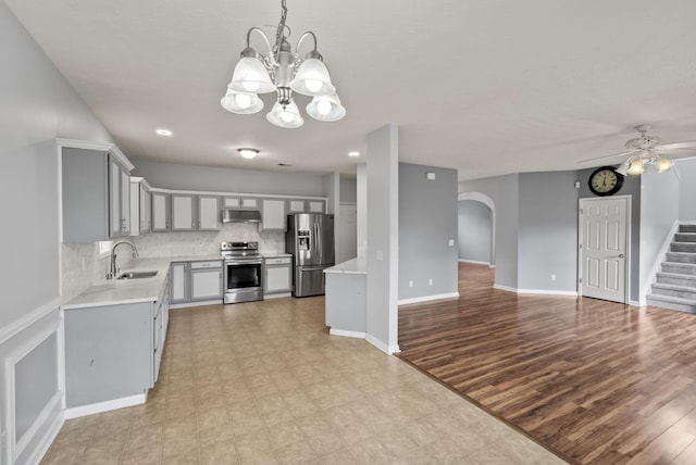 533 Lanarkshire Pl, Lexington, KY 40509 - kitchen featuring stainless steel appliances, under cabinet range hood, a sink, light countertops, and open floor plan
