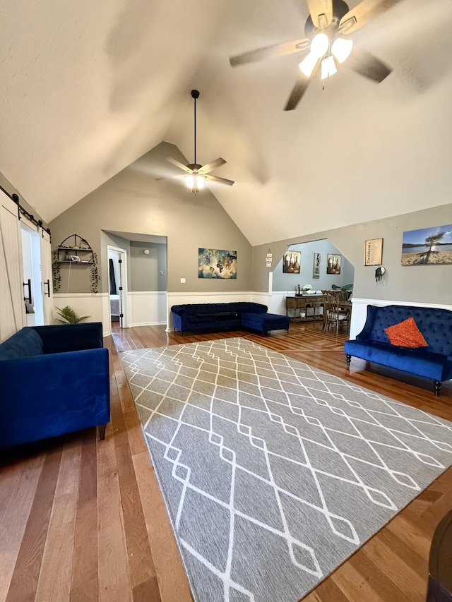 88 Powell Rd, Mckee, KY 40447 - living room with a ceiling fan, wood finished floors, lofted ceiling, and a barn door