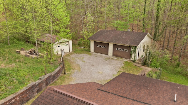 exterior space featuring a wooded view