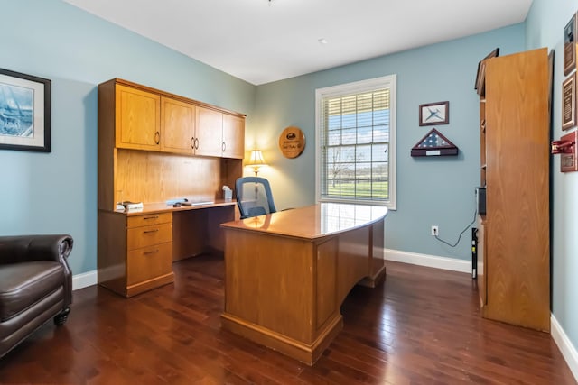 office area featuring dark wood finished floors and baseboards