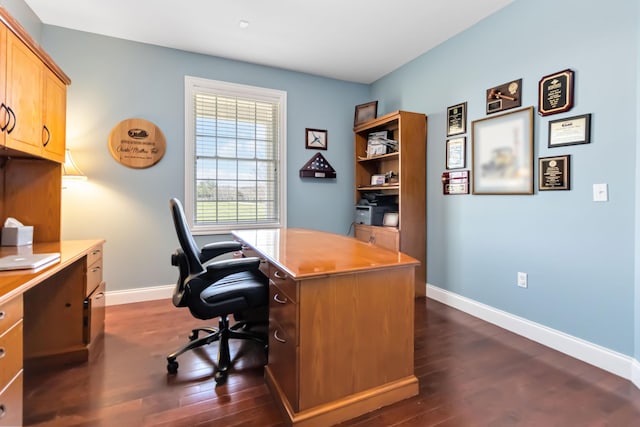 home office featuring baseboards and dark wood-type flooring